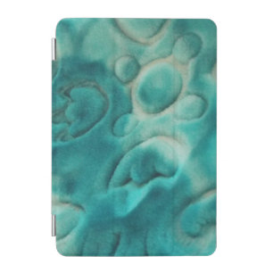 A swirling pattern in teal and light beige iPad mini cover