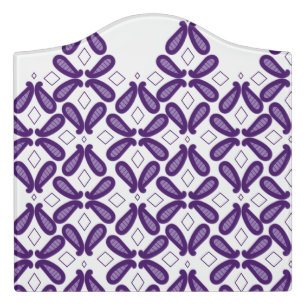 A symmetrical pattern featuring white and purple m door sign