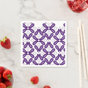A symmetrical pattern featuring white and purple m napkins
