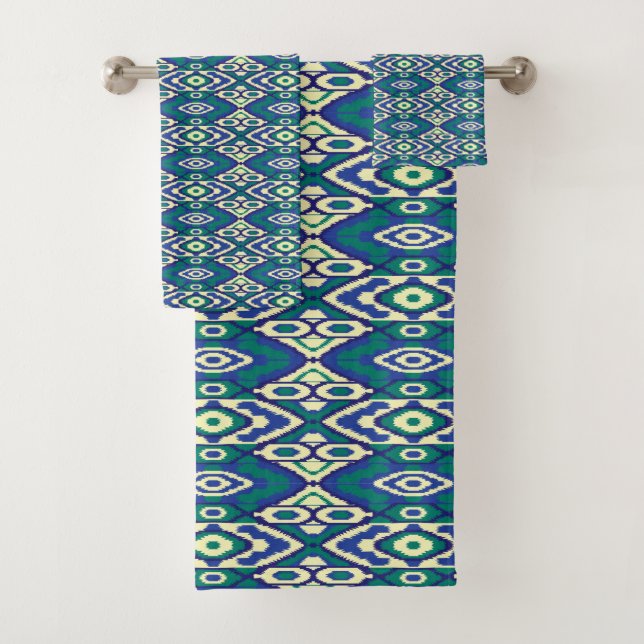 A symmetrical pattern of blue motifs on a textile  bath towel set (Insitu)