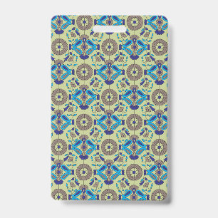 A symmetrical textile design featuring blue and or badge