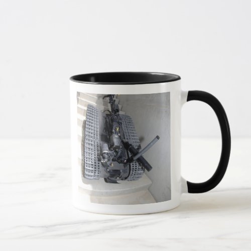 A Talon 3B robot unit climbing a flight of stai Mug