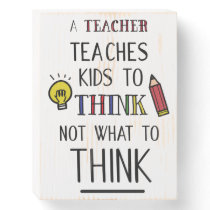 A teacher teaches kids to think not what to think wooden box sign