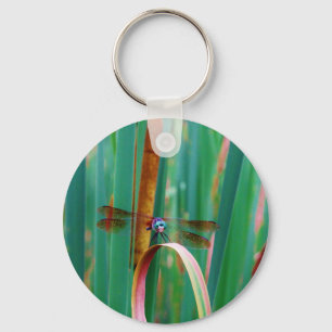 A teal Eyed Dragonfly with cattails Keychain