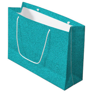 A teal glitter gift bag with white rope handles