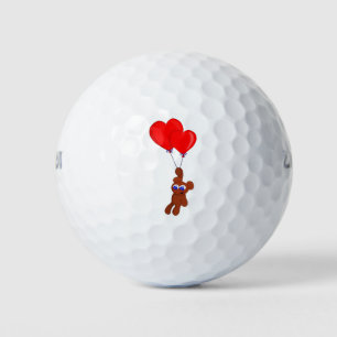 A Teddy Bear Holding Heart Shaped Balloons Golf Balls