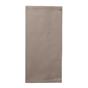 A textured background of various shades of brown, cloth napkin