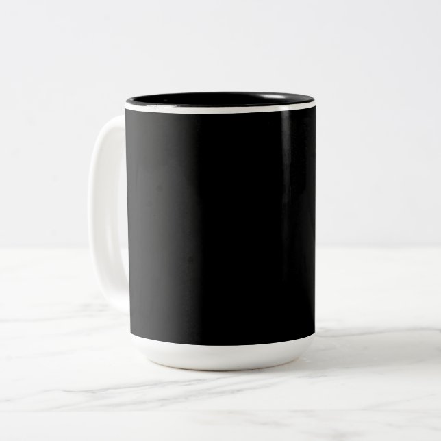 A textured black surface with subtle grain pattern Two-Tone coffee mug (Front Left)