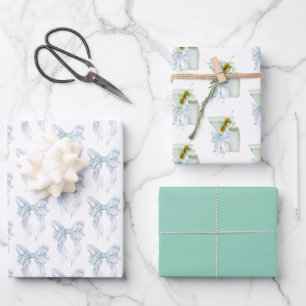 A tini boy  wrapping paper sheets