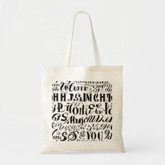 A tote bag with black colored text on it