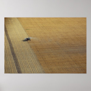 A tractor harvesting poster