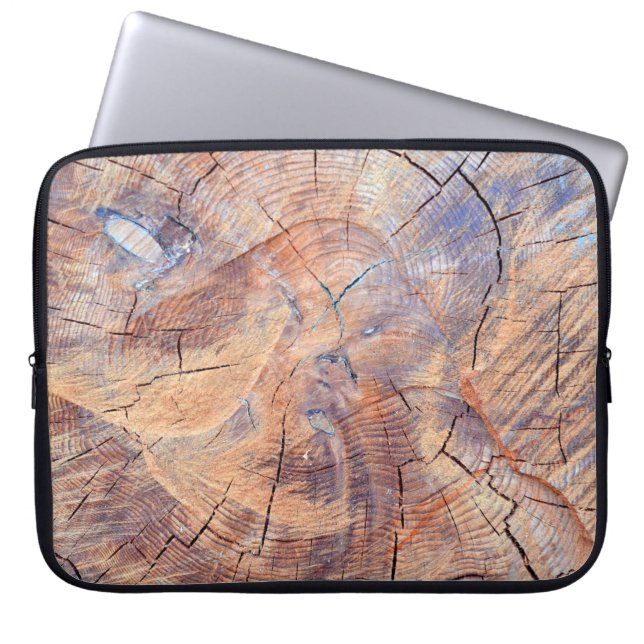 A tree in a cut. Logs lumber in the woods. Texture Laptop Sleeve (Front)