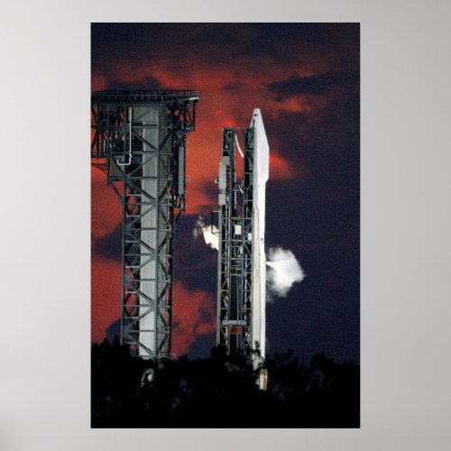A United Launch Alliance Atlas V rocket vents liqu Poster