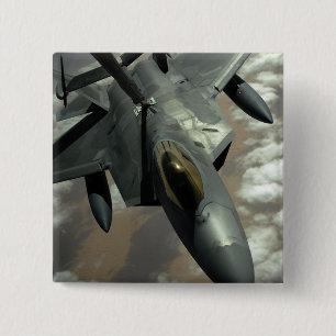 A US Air Force F-22 Raptor is refueled by a KC- Button