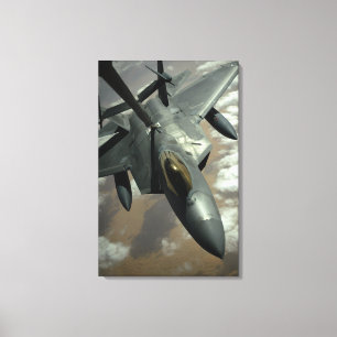 A US Air Force F-22 Raptor is refueled by a KC- Canvas Print