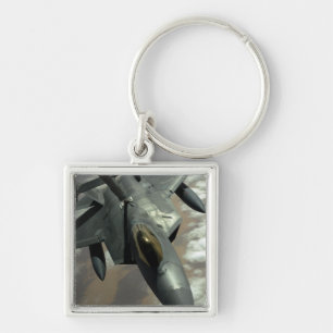 A US Air Force F-22 Raptor is refueled by a KC- Keychain