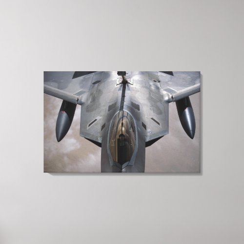A US Air Force F_22 Raptor is refueled Canvas Print