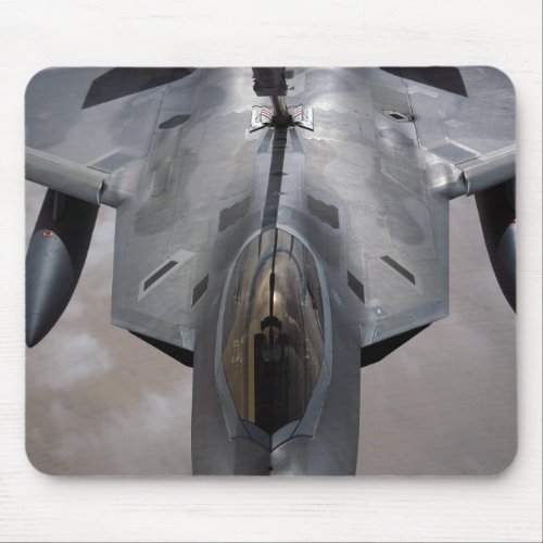 A US Air Force F_22 Raptor is refueled Mouse Pad