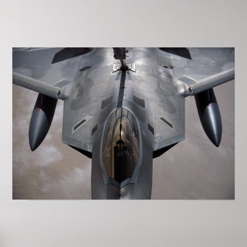 A US Air Force F_22 Raptor is refueled Poster