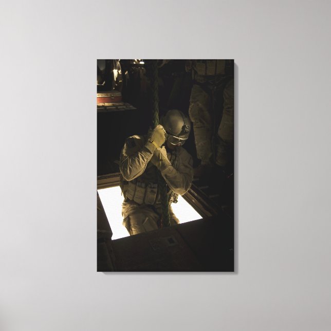 A US Air Force pararescueman begins his descent Canvas Print (Front)