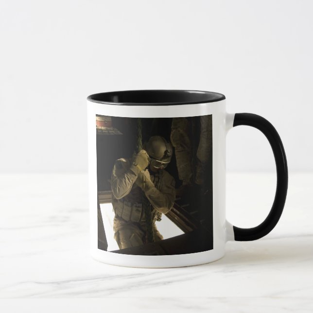 A US Air Force pararescueman begins his descent Mug (Right)