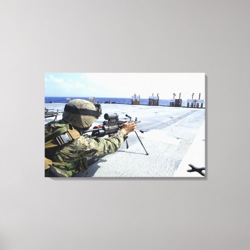 A US Marine adjusting his weapon Canvas Print