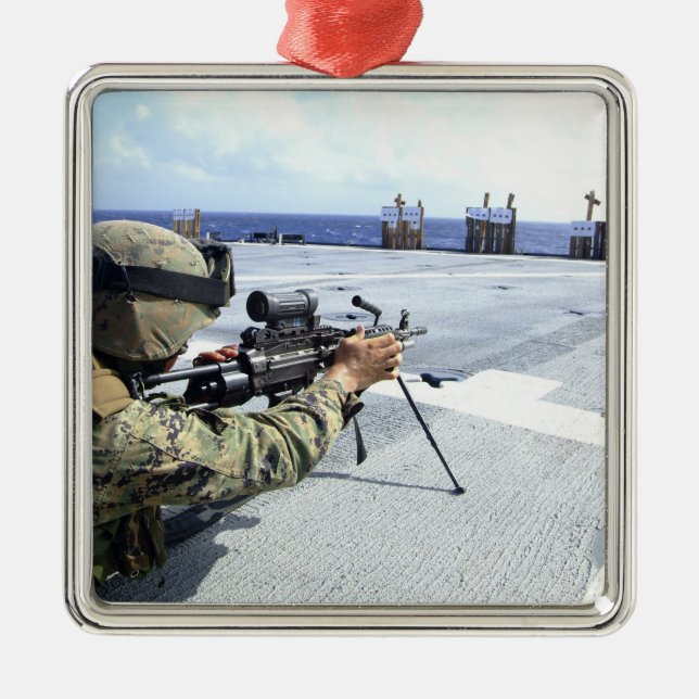 A US Marine adjusting his weapon Metal Ornament (Front)