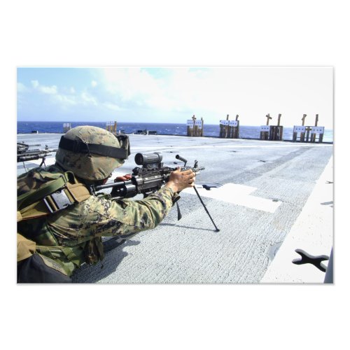 A US Marine adjusting his weapon Photo Print