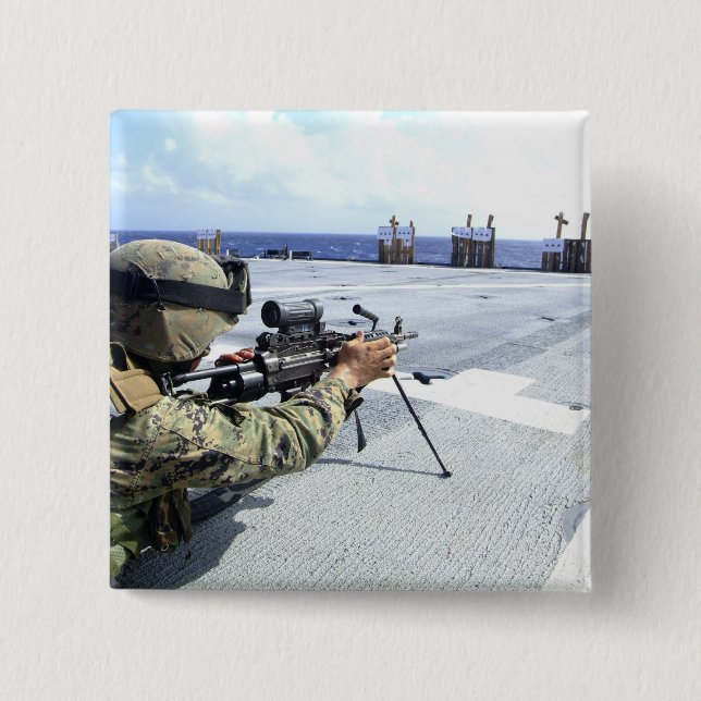 A US Marine adjusting his weapon Pinback Button (Front)