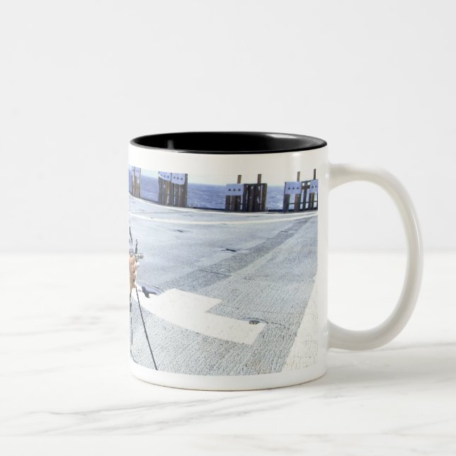 A US Marine adjusting his weapon Two-Tone Coffee Mug (Right)