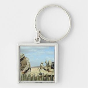 A US Marine prepares howitzer rounds to be fire Keychain