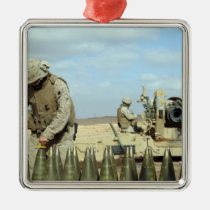 A US Marine prepares howitzer rounds to be fire Metal Ornament