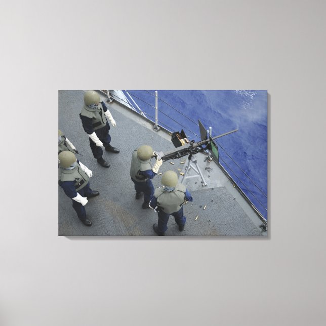 A US Sailor fires a 50-caliber M2HB Canvas Print (Front)