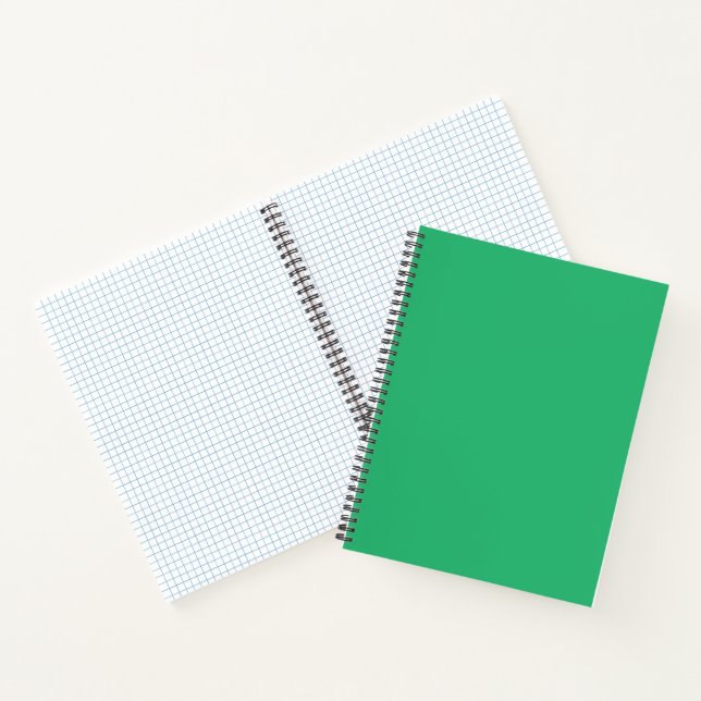 A vibrant green leaf with prominent veins and a de notebook (Inside)