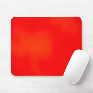 A vibrant red and orange rectangular placemat mouse pad