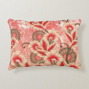 A vibrant red and peach textile design featuring f accent pillow