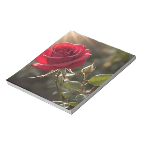 A vibrant red rose symbolizing love and passion notepad