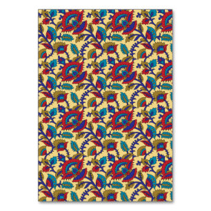 A vibrant textile art piece featuring bold red, ye table number