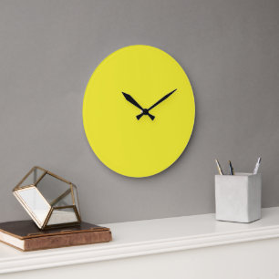 A vibrant yellow square enclosed by a crisp white large clock