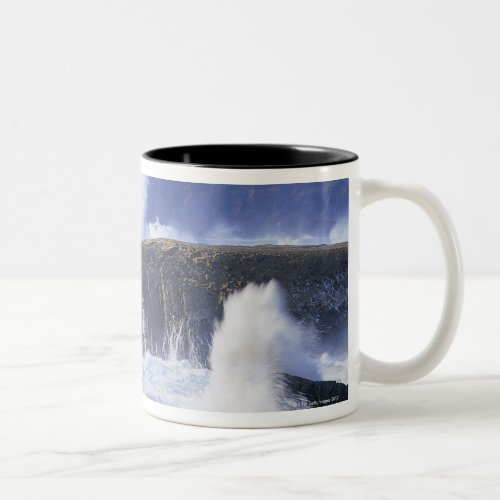 a view of the waves crashing against rocks Two_Tone coffee mug