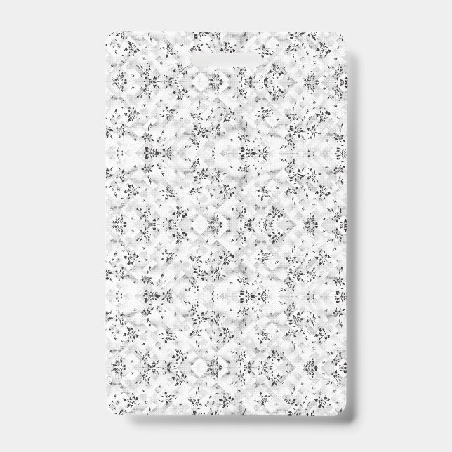 A visually striking white and black patterned wall badge (Front)