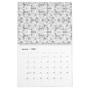 A visually striking white and black patterned wall calendar
