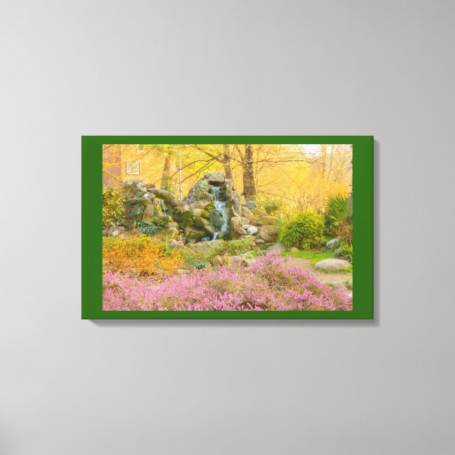 a waterfall in a flowered park on wrapped canvas print (Front)