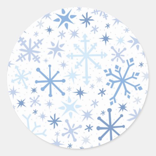 A whimsical flurry of blue snowflakes on white classic round sticker