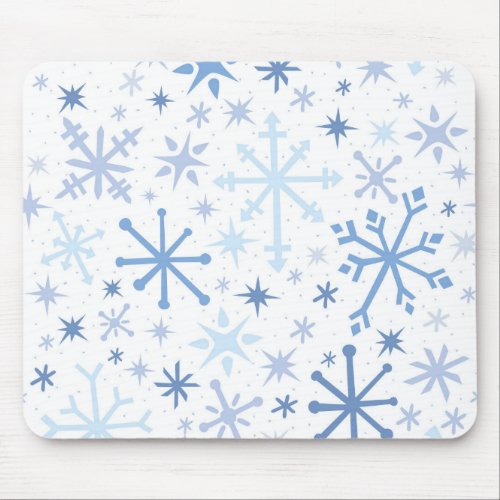 A whimsical flurry of blue snowflakes on white mouse pad
