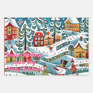 A whimsical winter scene features a lively village wrapping paper sheets