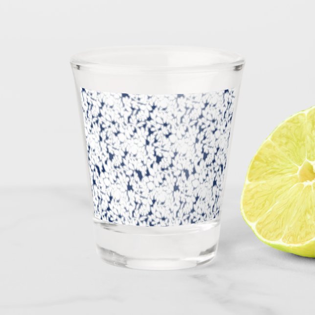 a white and blue background with a pattern shot glass (Front)
