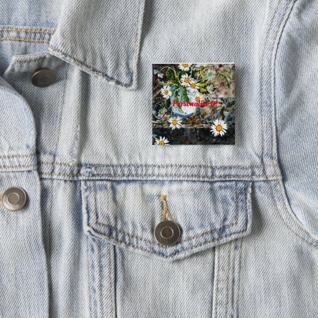 A white and blue pot of wild daisies on a shelf button (In Situ)