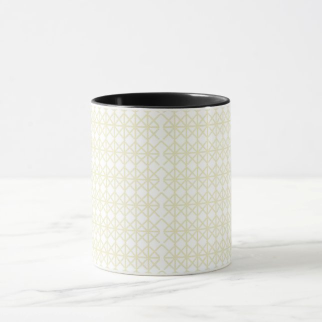 a white and gold geometric pattern mug (Center)