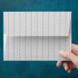 a white and gray wallpaper with a pattern on it envelope